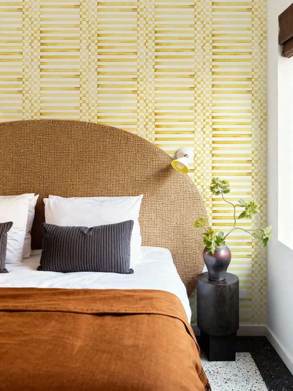 Yellow wallpaper with natural textures and warm interiors